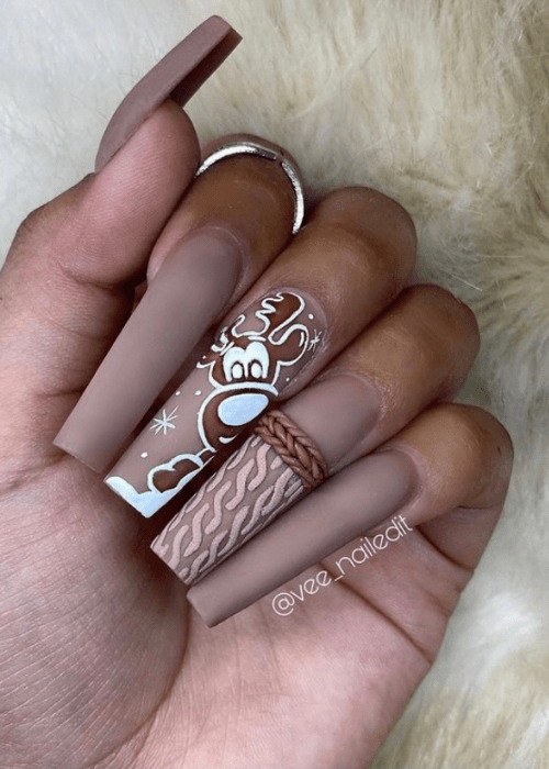 Brown nail design with a reindeer