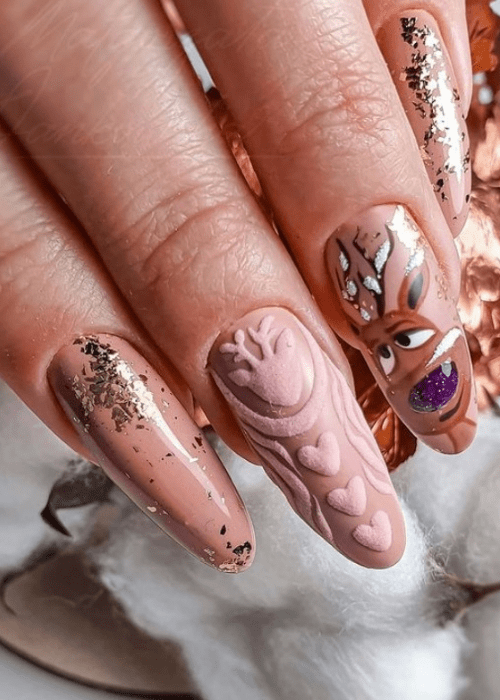 Tan nail design with gold sparkles and a reindeer