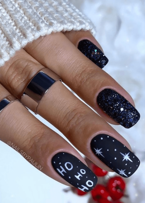 Starry Christmas nail design that says ho ho ho