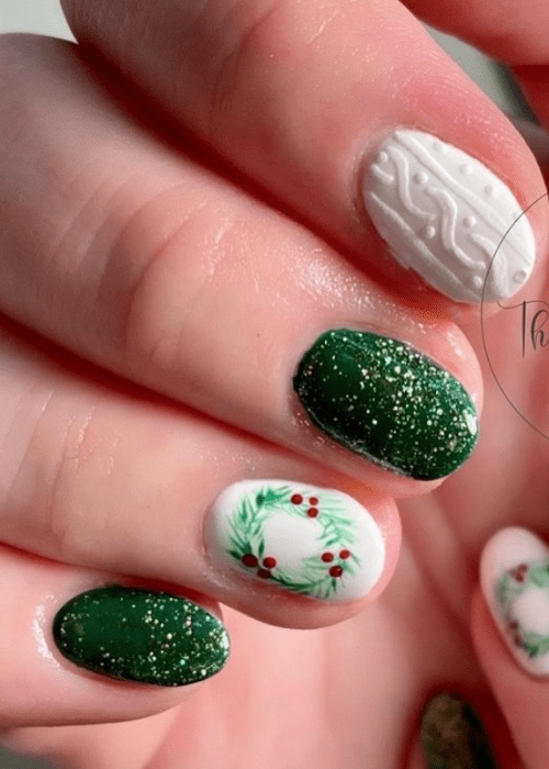 Red and green Christmas nail design with a wreath