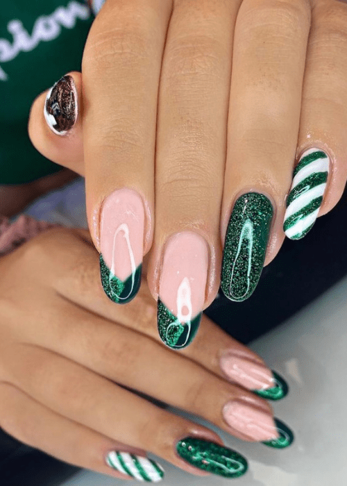 Simple green Christmas nail art with candy cane design