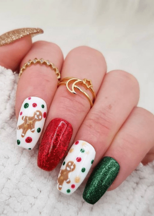 Red white and green Christmas nail design with two gingerbread men