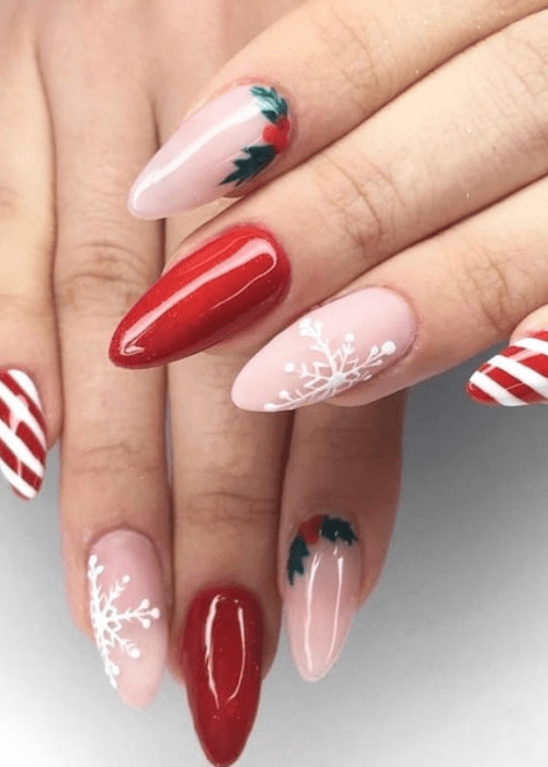 Pink and red Christmas nail design with a snowflake and a mistletoe