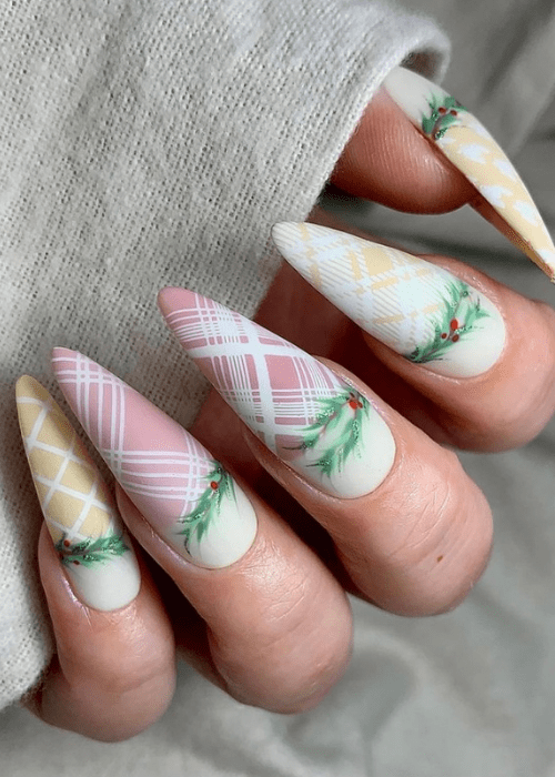 Pastel and plaid nail design with mistletoe
