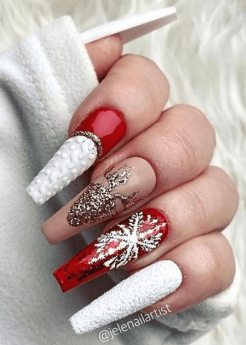 White and red nail design with a reindeer