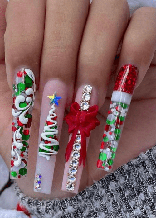 Long Christmas nail designs with a Christmas tree and a big red bow