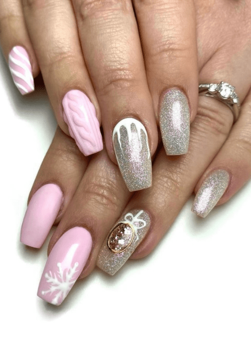 Pink and silver nail design with a snowflake