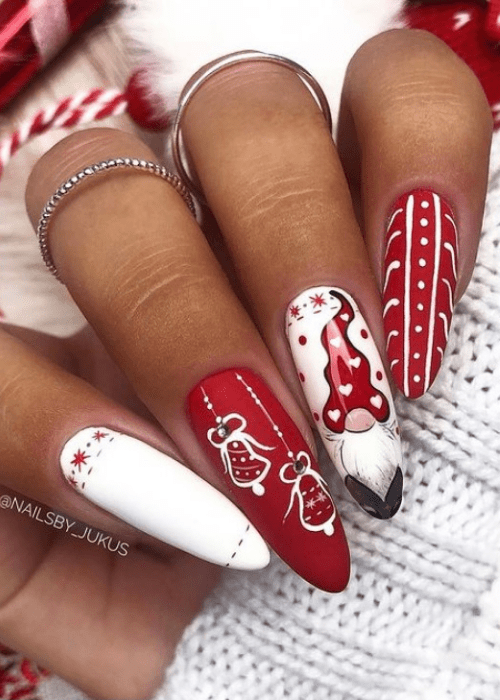 Red and white Christmas nail design with a gnome