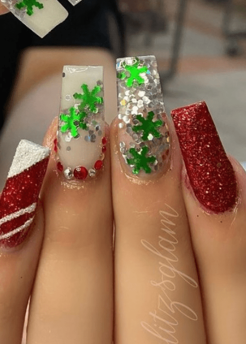 Sparkly green and red nail design with green snowflakes