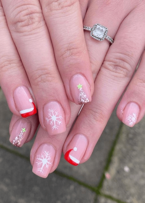 Short Christmas nail design with Santa hats and snowflakes