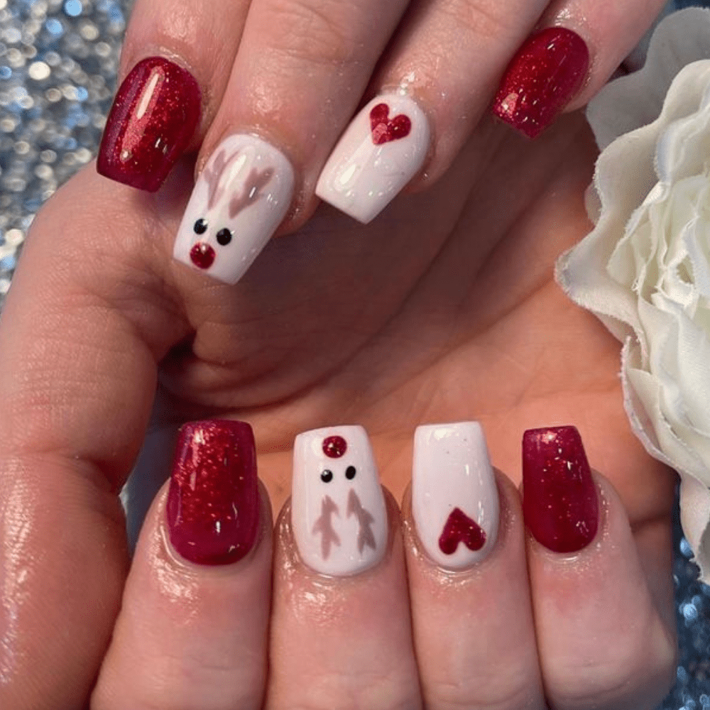 Nails with a reindeer design and a heart