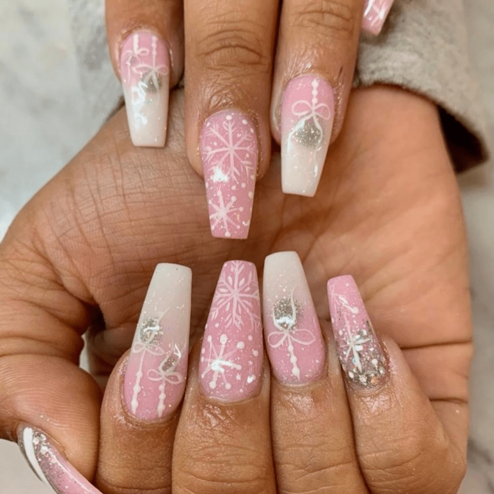 A pink and white Christmas nail design