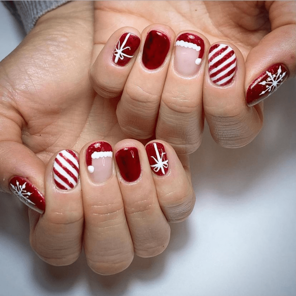 Nails with a Santa hat and snowflakes