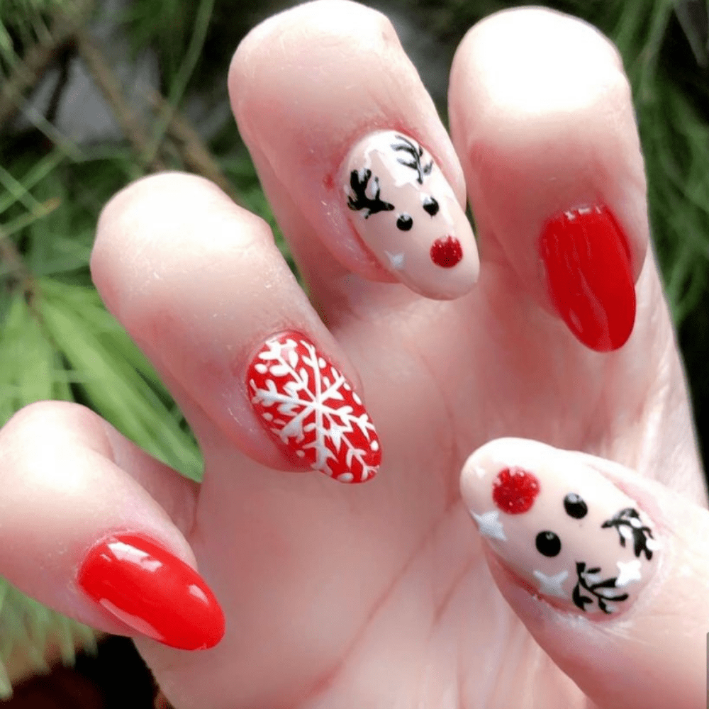 A nail design with a Reindeer and a snowflake
