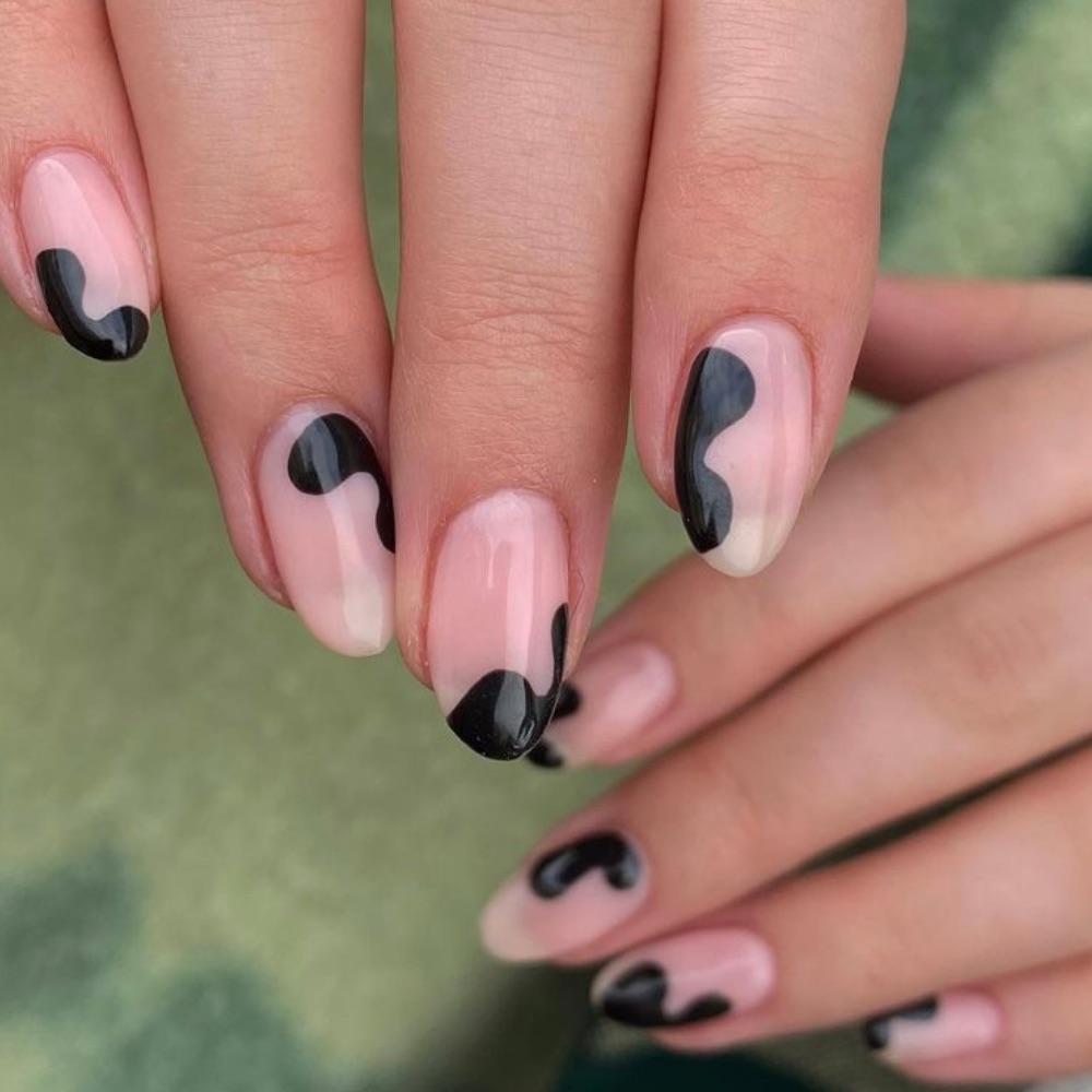 Short nails with random black blobs on them