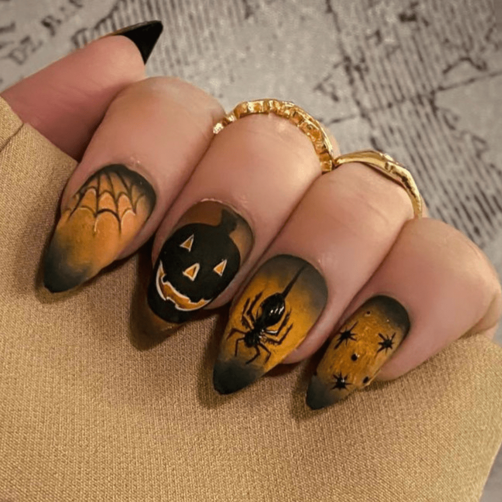 Orange and black Halloween nail design on short stilleto nails