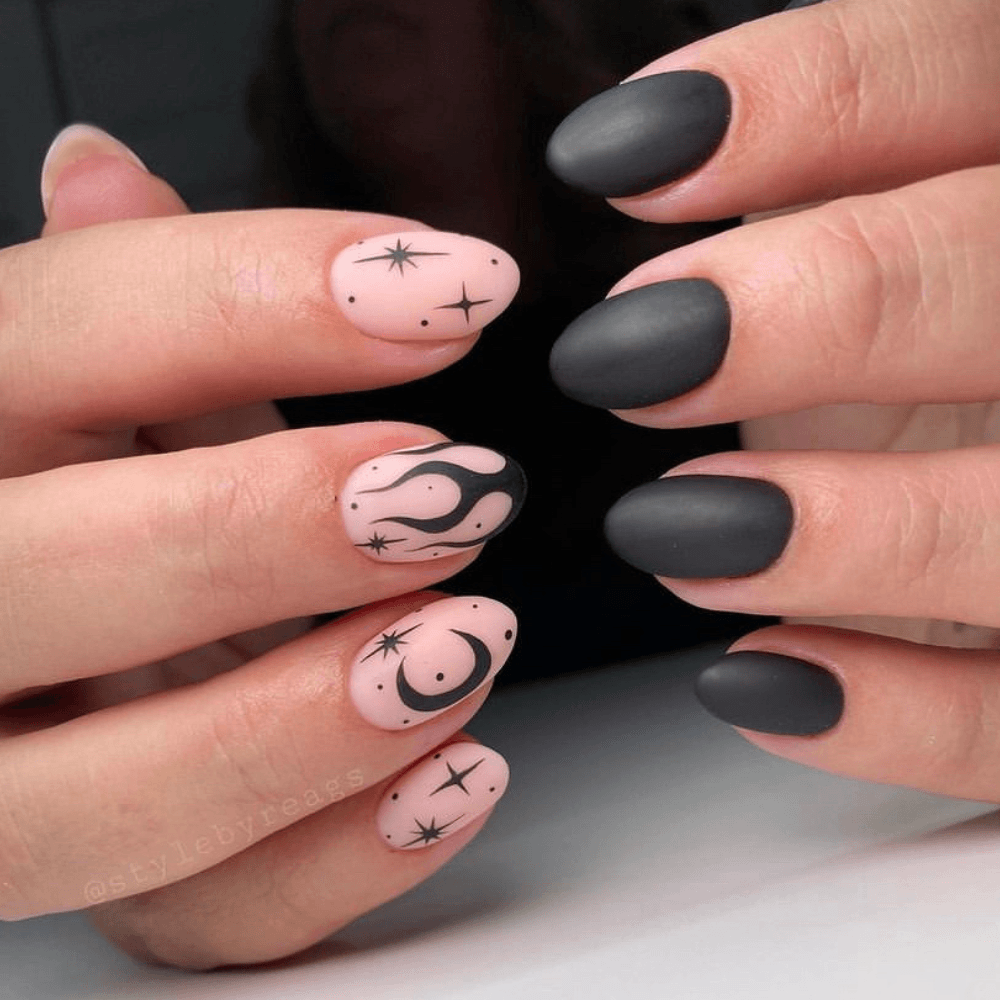 Black matte nails on one hand and black nail designs on the other hand