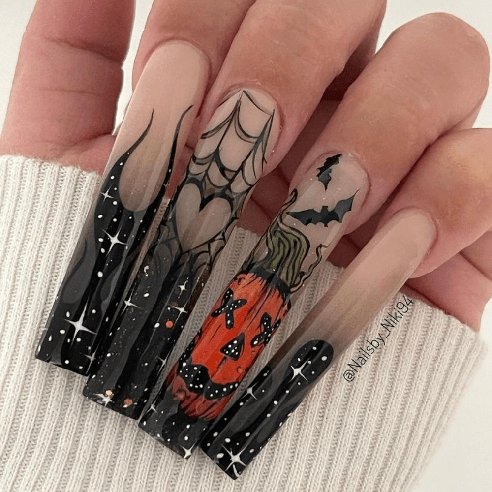 Long nails with a pumpkin design and stars